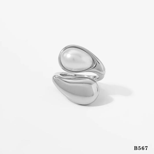 Anillo plateado de perla blanca y café