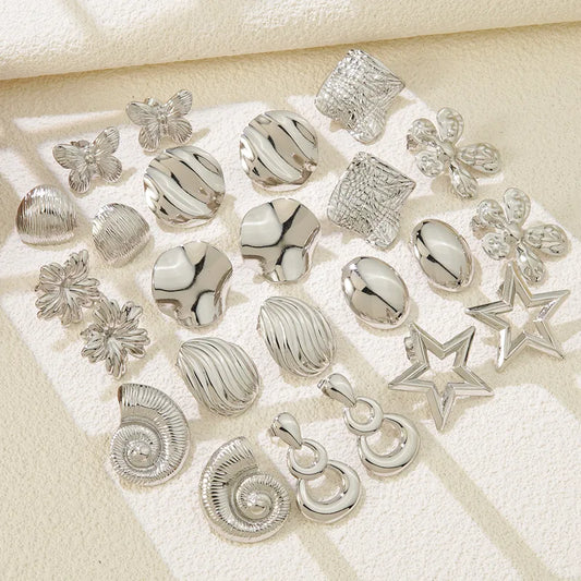 Aretes plateados con gota y dos aros